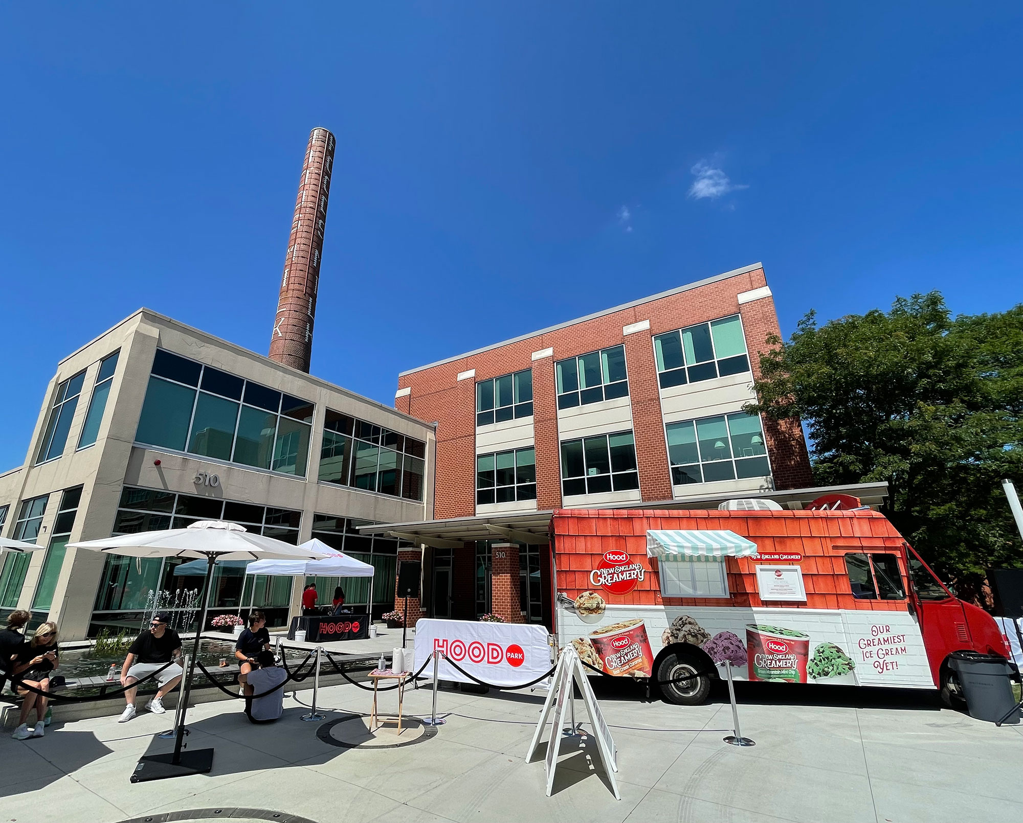 Brick building on the Hood Park campus with white accents and an American flag on the top