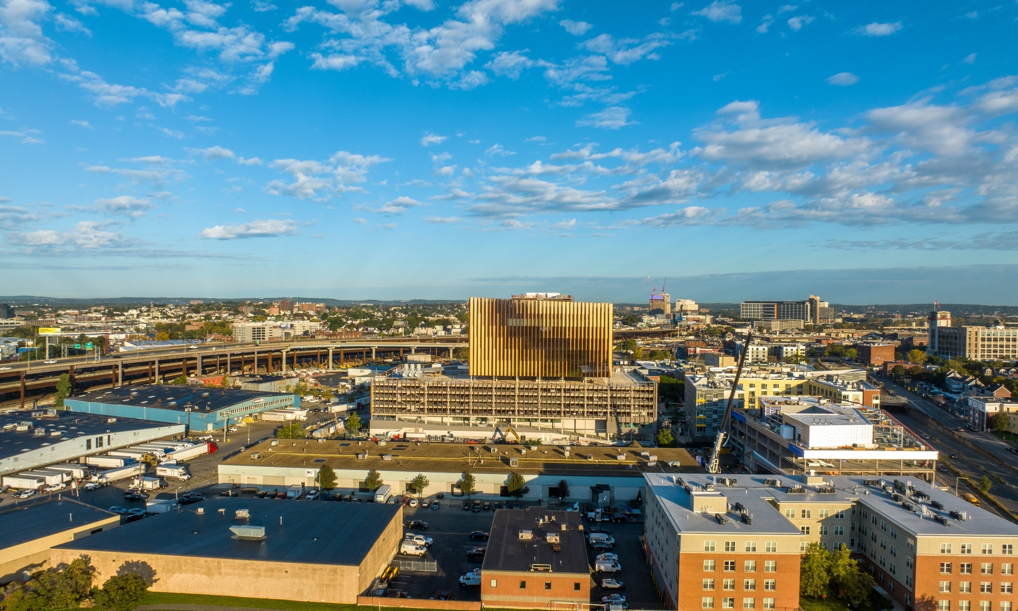 Aerial view of Charlestown, with view of Hood Park tower, blue sky with fluffy clouds.