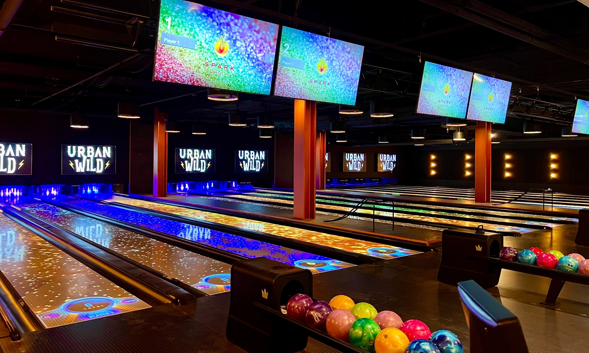 Bowling lanes, Tvs and colorful bowling balls